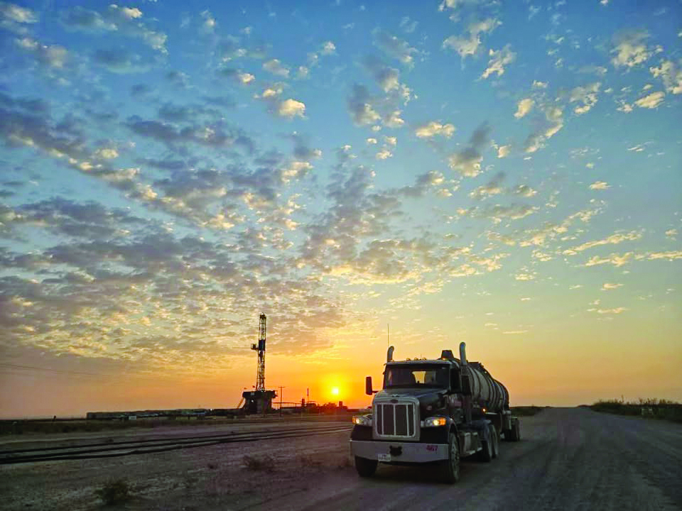 Coastal Plains Trucking truck is pictured among a sunrise in Orla, Texas.